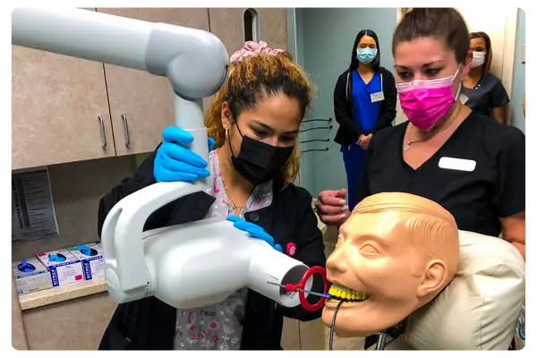 Dental Assistant Student using an X-ray
